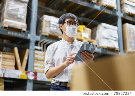 Portrait Asian men, staff, product counting Warehouse Control Manager Standing, counting and inspecting products in the warehouse Portrait Asian men, staff, product counting Warehouse Control Manager Standing, counting and inspecting products in the warehouse 78857224