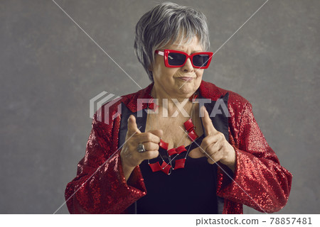 Old funny female crazy confident trendy person studio shot face portrait 78857481