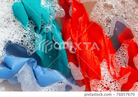 Color clothes soak in powder detergent water dissolution. Laundry concept 78857670