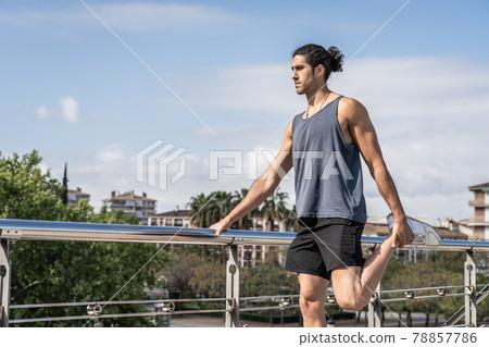 athlete men stretching muscles after power exercise athlete men stretching muscles after power exercise 78857786
