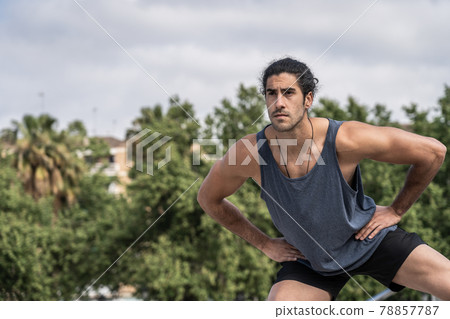 Athlete man doing gymnastic exercises to strength muscles 78857787