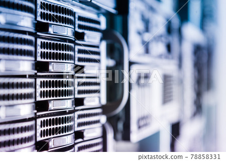 Cluster of data storage hard drives inside server room 78858331
