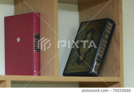 Quran placed on a shelf of a school library Quran placed on a shelf of a school library 78858686
