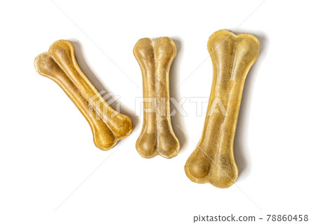 bone for dogs isolated on white background Top view Flat lay Delicious treat for your beloved pet Food for animals concept 78860458