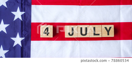 Fourth of July text on United States of America flag background. USA holiday of Independence and celebration concepts Fourth of July text on United States of America flag background. USA holiday of Independence and celebration concepts 78860534