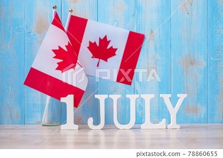 Wooden calendar of July 1st with miniature Canada flags. Canada Day and happy celebration concepts Wooden calendar of July 1st with miniature Canada flags. Canada Day and happy celebration concepts 78860655