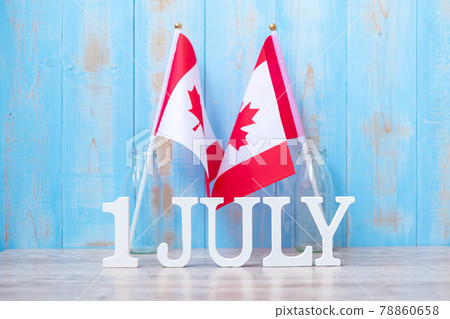 Wooden calendar of July 1st with miniature Canada flags. Canada Day  and happy celebration concepts 78860658