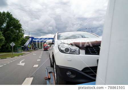 car is transported on tow truck.transporting cars after accidents and breakdowns 78861501