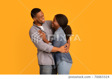 Happy Young African American Spouses Embracing And Smiling To Each Other 78863324