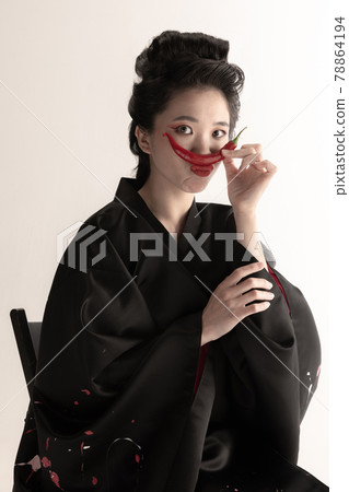 Portrait of young beautiful Japanese, woman in national attire kimono posing isolated over white studio background. Portrait of young beautiful Japanese, woman in national attire kimono posing isolated over white studio background. 78864194