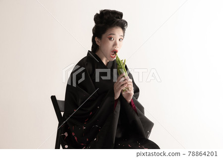Portrait of young beautiful Japanese, woman in national attire kimono posing isolated over white studio background. Portrait of young beautiful Japanese, woman in national attire kimono posing isolated over white studio background. 78864201