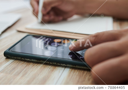 Businessman Calculating Profit 78864405