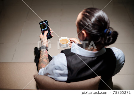 Man Checking Investment App Man Checking Investment App 78865271