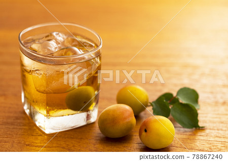 A glass of plum wine with ice A glass of plum wine with ice 78867240