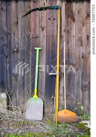 agriculture tools and old wooden farm wall agriculture tools and old wooden farm wall 78867703