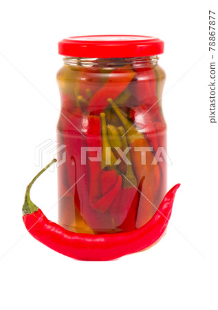 potted red peppers in glass jar on white potted red peppers in glass jar on white 78867877