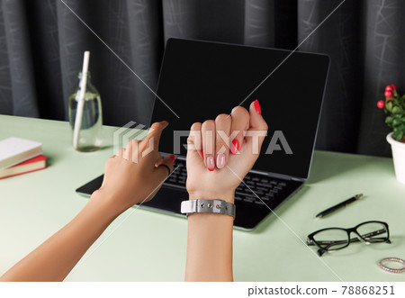 Beautiful groomed womans hands over green table. Female summer accessories 78868251