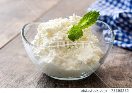 Fresh cottage cheese in a metal bowl Fresh cottage cheese in a metal bowl 78868285
