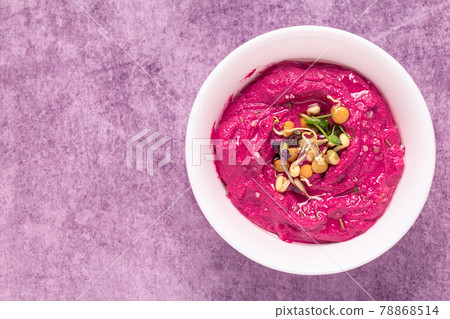 Roasted Beet Hummus in a bowl. Roasted Beet Hummus in a bowl. 78868514