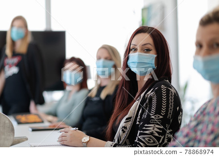real business people on meeting wearing protective mask real business people on meeting wearing protective mask 78868974