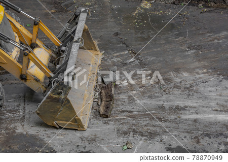 Specialized bulldozer for road repair and paving. In action Specialized bulldozer for road repair and paving. In action 78870949