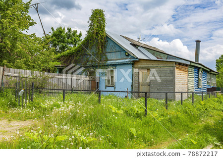Part of the old facade of an abandoned village house Part of the old facade of an abandoned village house 78872217