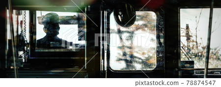 View from inside a train of the driver and his cab. View from inside a train of the driver and his cab. 78874547