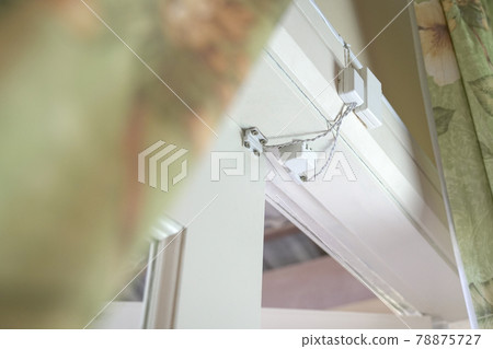 Magnetic alarm sensor installed on door for home security. 78875727