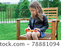 Caucasian little girl playing with pop it silicone trendy rainbow colow toy 78881094
