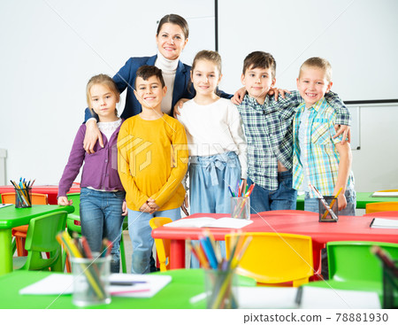 Teacher and happy children in classroom Teacher and happy children in classroom 78881930