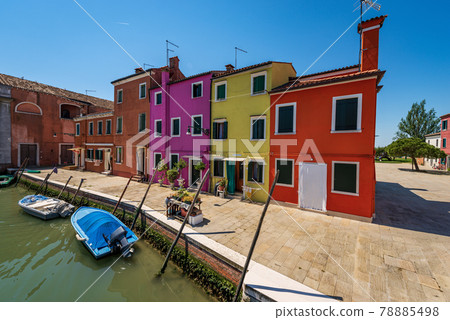 Small Multi Colored Houses and Canal with Boats in Burano Island - Venice Italy Small Multi Colored Houses and Canal with Boats in Burano Island - Venice Italy 78885498