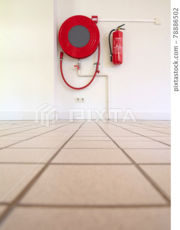 Fire hose on a wall Fire hose on a wall 78886502
