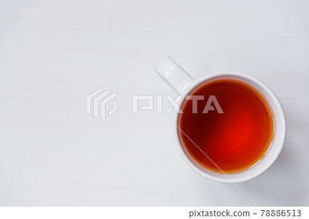Cup of tea on white wooden table. Cup of tea on white wooden table. 78886513