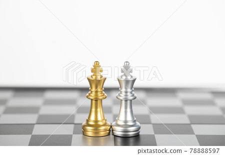 The silver king chess and the gold king chess on the empty chess board , business strategy The silver king chess and the gold king chess on the empty chess board , business strategy 78888597