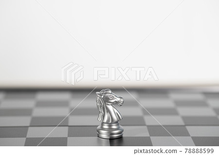 The silver horse chess alone on the chess board , business strategy The silver horse chess alone on the chess board , business strategy 78888599