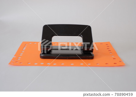 Hole punch and orange drawing paper Hole punch and orange drawing paper 78890459