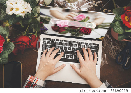Online home flower arrangement concept, asian woman Smiling florist record video broadcast or course on smartphone or computer, compose arrange floral decorations,online flower shop 78890969