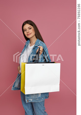 beautiful woman holding shopping bags with purchases 78892286