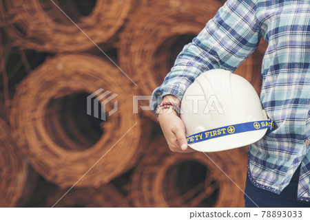 Woman construction engineer wear safety white hard hat at construction site industry worker. Female engineer worker civil engineering with hard hat safety helmet. Woman construction Engineer concept 78893033