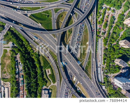 Busy multilevel junction in summer in outskirts Busy multilevel junction in summer in outskirts 78894414