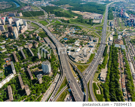 Busy multilevel junction in summer in outskirts Busy multilevel junction in summer in outskirts 78894415