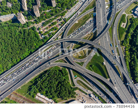 Busy multilevel junction in summer in outskirts Busy multilevel junction in summer in outskirts 78894416