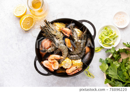 Seafood boil ingredients ready for cooking, overhead view Seafood boil ingredients ready for cooking, overhead view 78896220