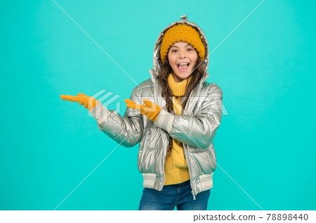 smiling stylish child presenting product, copy space. smiling stylish child presenting product, copy space. 78898440