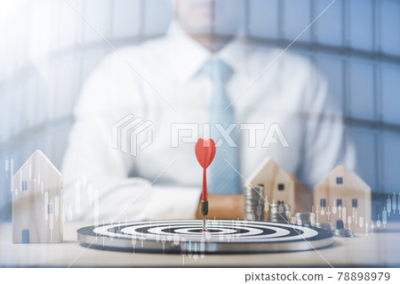 Targeting the business concept, Businessman touch red arrow dart to the virtual target dartboard, Executive marketing, investment goal and target for business investment concept, mini home. 78898979