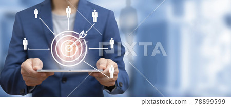 Targeting the HR business concept, Businessman holding tablet and arrow dart to virtual target dart board,Executive marketing, investment goal and target for business investment concept. 78899599