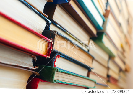 Background. Many old books and textbooks are in the library. Background. Many old books and textbooks are in the library. 78899805
