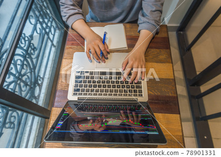 Overhead view of investor trading on stock market 78901331