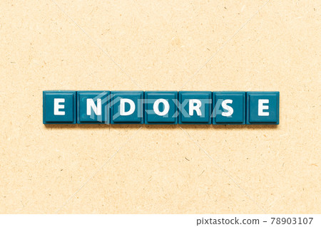 Tile alphabet letter in word endorse on wood background Tile alphabet letter in word endorse on wood background 78903107