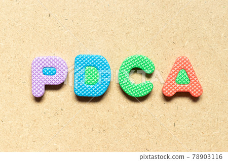 Foam alphabet letter in word PDCA (Abbreviation of plan do check act) on wood background Foam alphabet letter in word PDCA (Abbreviation of plan do check act) on wood background 78903116